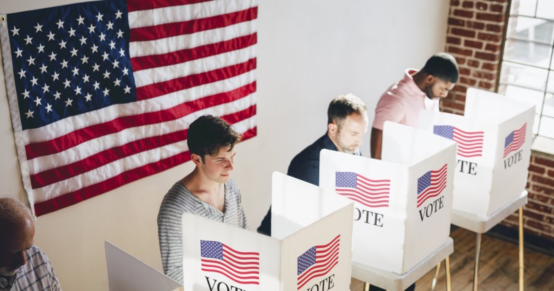 American at a polling booth sideways